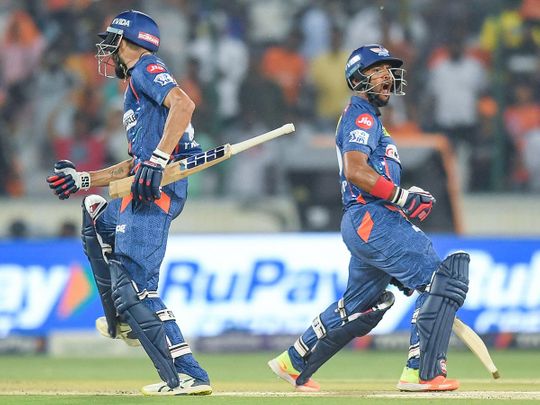 Lucknow Super Giants' Prerak Mankad (L) and Nicholas Pooran celebrate 