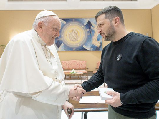 Pope Francis shakes hands with Ukrainian President Volodymyr Zelensky