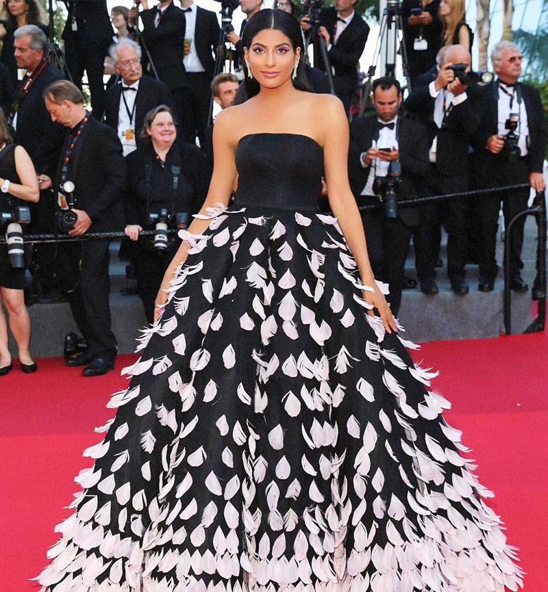 Farhana Bodi opts for black gown with feather detailing in Cannes 2022. Cannes is as much about the fashion and glamour, as it's about the movies
