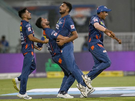 Lucknow Super Giants' Mohsin Khan (C) with teammates celebrate