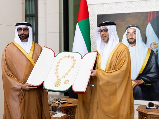 Sheikh Mansour bin Zayed Al Nahyan (right) presenting the medal to Mohammed bin Ahmed Al Bowardi at Qasr Al Watan in Abu Dhabi on Wednesday