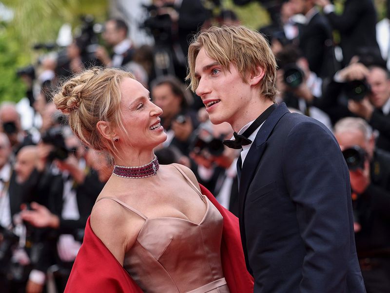 Uma Thurman, left, and Levon Hawke pose for photographers upon arrival at the opening ceremony and the premiere of the film 'Jeanne du Barry' at the 76th international film festival, Cannes, southern France, Tuesday, May 16, 2023. 