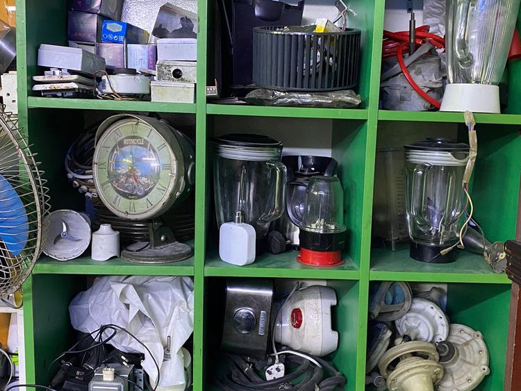 Glimpses of an electrical appliances repair shop in Satwa.