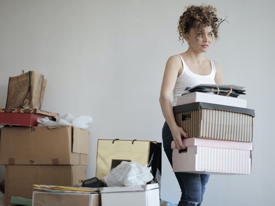 Woman decluttering her home