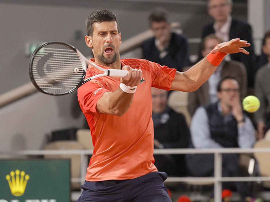 Serbia's Novak Djokovic plays a forehand return 