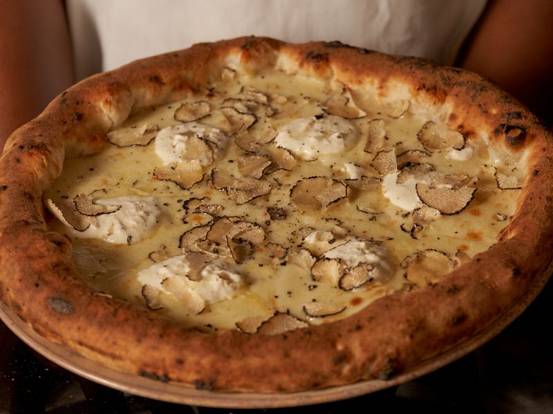 Enjoy freshly made pizzas and more at Monno.