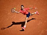 Serbia's Novak Djokovic plays a forehand return