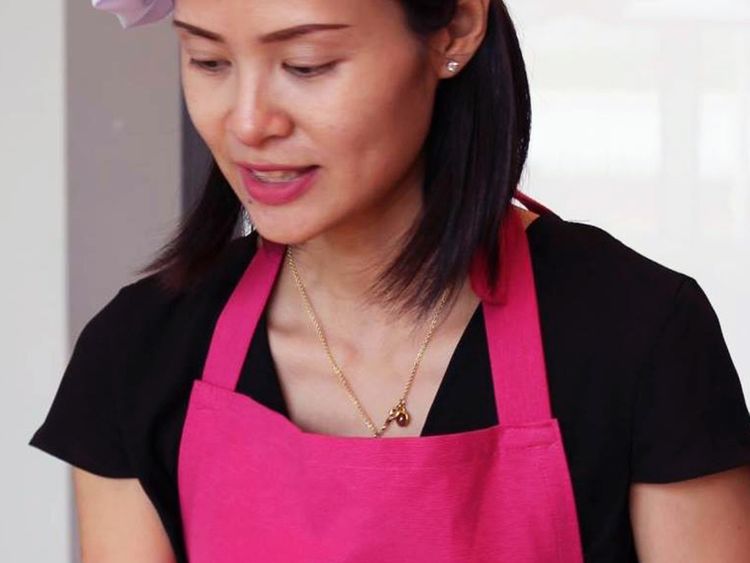 Chef Lily Nguyen teaching a cooking class at home