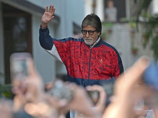 Bollywood actor Amitabh Bachchan greets fans outside his residence on the occasion of his golden jubilee wedding anniversary in Mumbai on June 4, 2023.