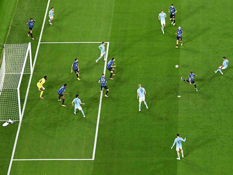 Manchester City's Spanish midfielder #16 Rodri (R) shoots to score his team's first goal during the UEFA Champions League final football match against Inter Milan at the Ataturk Olympic Stadium in Istanbul, on June 10, 2023. 