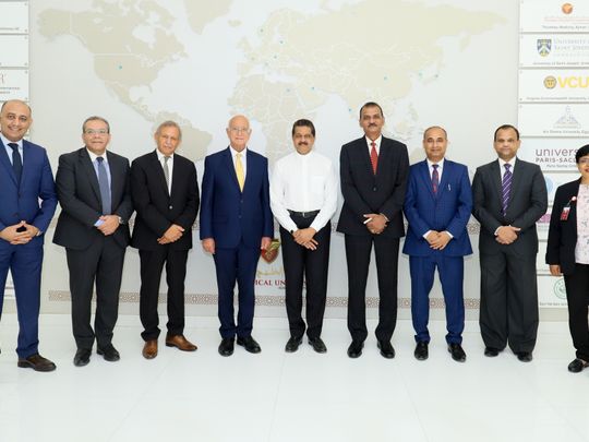 Dr Thumbay Moideen, founder president of Thumbay Group along with Professor Hossam Hamdy, chancellor and academic team of Gulf Medical University (2)