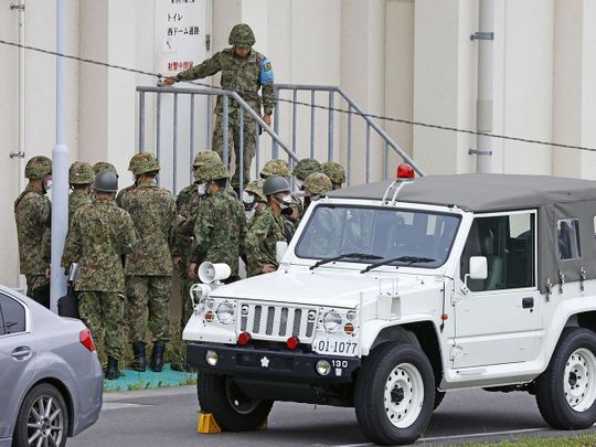 Members of the Japanese Self-Defence Force (SDF) are seen around the shooting range, in which a teenage member of SDF was arrested on suspicion of attempted murder after a shooting incident, in Gifu, Gifu Prefecture, on June 14, 2023. 