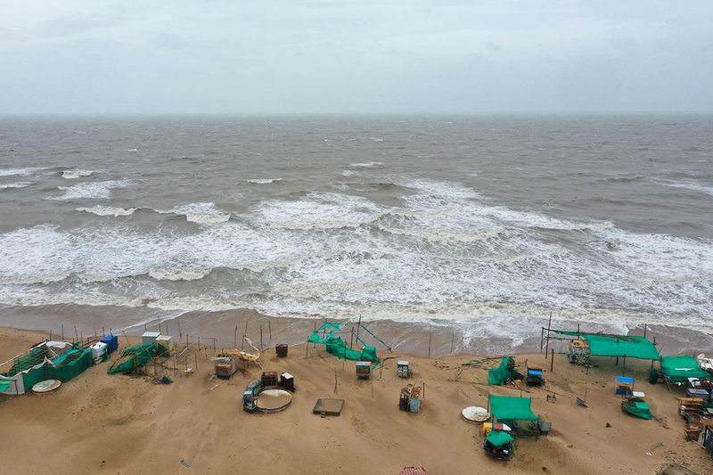 An aerial view shows the deserted Mandvi beach some 100 Km southeast of Jakhau Port on June 15, 2023, ahead of Cyclone Biparjoy landfall. Howling gales and crashing waves pounded the coastline of India and Pakistan on June 15, hours before the landfall of a powerful cyclone that has prompted mass evacuations.