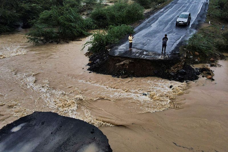 A drone view of a broken bridge, after Cyclone Biparjoy made landfall, along the Naliya-Bhuj highway, in the western state of Gujarat, India, June 16, 2023. 