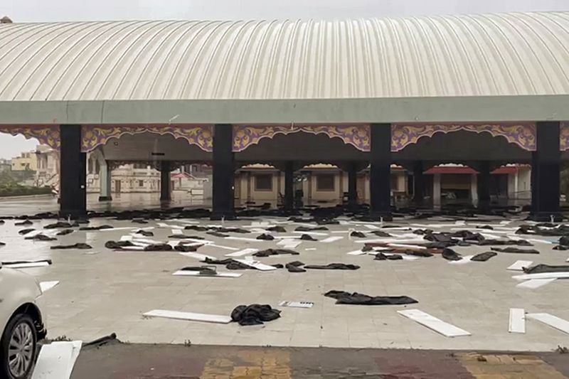 A glimpse of the aftermath of strong winds and heavy rain triggered by Cyclone 'Biparjoy', in Mandvi on Friday.