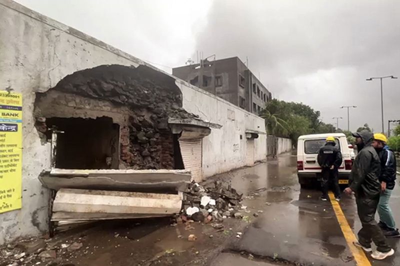 Part of a building collapses after strong winds and heavy rainfall triggered by the cyclone 'Biparjoy', in Jamnagar.