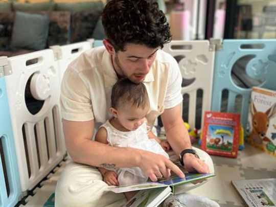 Nick Jonas reads to his daughter Malti Marie