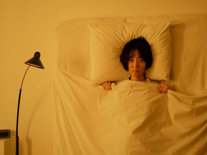Person lying in bed
