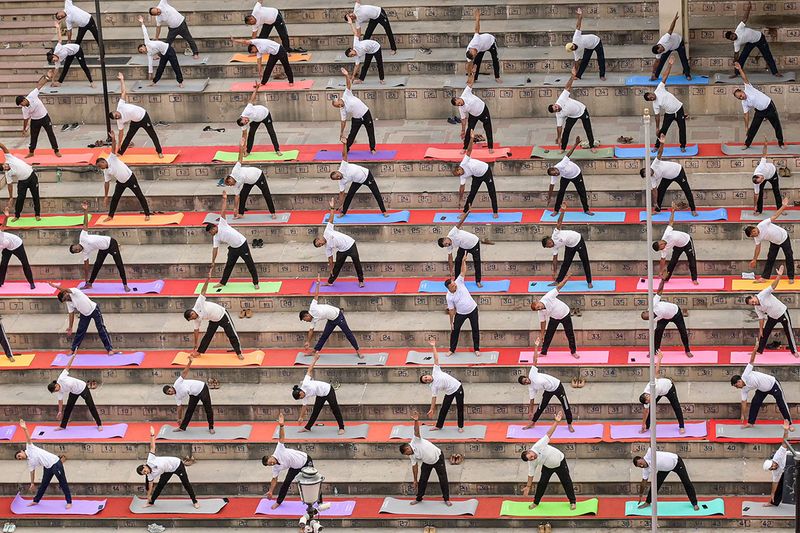 Border Security Force (BSF) personnel take part in a yoga session on the International Day of Yoga, at India-Pakistan Wagah border post about 35kms from Amritsar on June 21, 2023.