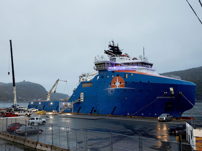 Equipment that was flown in by US Air Force transport planes is loaded onto the offshore vessel Horizon Arctic, before its deployment to the search area of a missing OceanGate Expeditions submersible which had been carrying five people to explore the sunken Titanic, in the port of St. John’s, Newfoundland, Canada. 