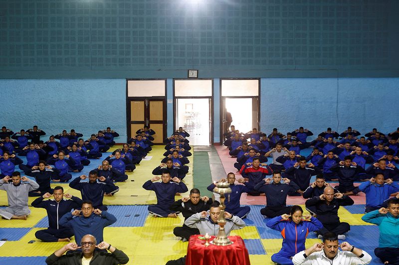 Nepal police personnel perform yoga during the International Yoga Day at National Police Academy in Kathmandu, Nepal June 21, 2023.