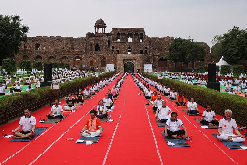 People perform yoga on International Yoga Day at Purana Qila, or Old Fort in New Delhi, India, June 21, 2023. 