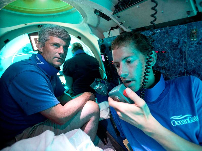 File photo: Submersible pilot Randy Holt, right, communicates with the support boat as he and Stockton Rush, left, CEO and Founder of OceanGate Expeditions, dive in the company's submersible, 