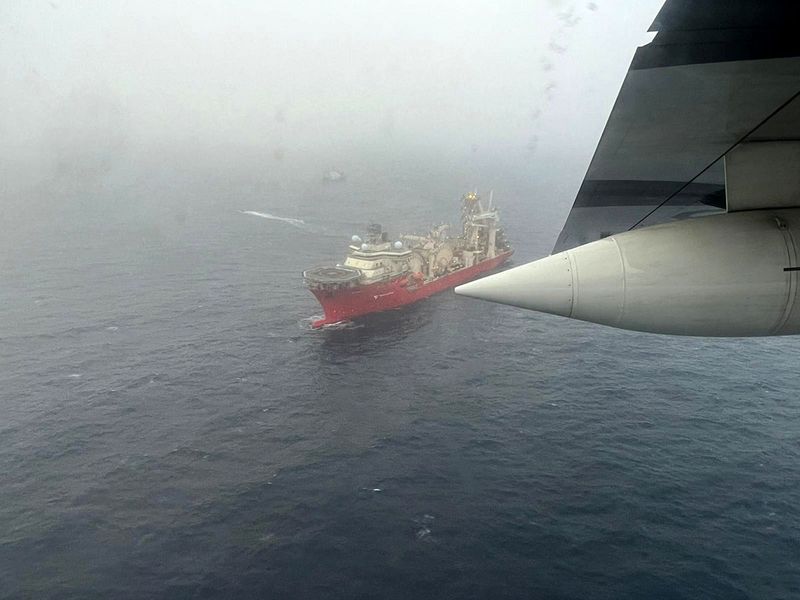 In this aerial image obtained from the US Coast Guard, the ship Deep Energy sails in the search area for OceanGate's Titan submersible. 