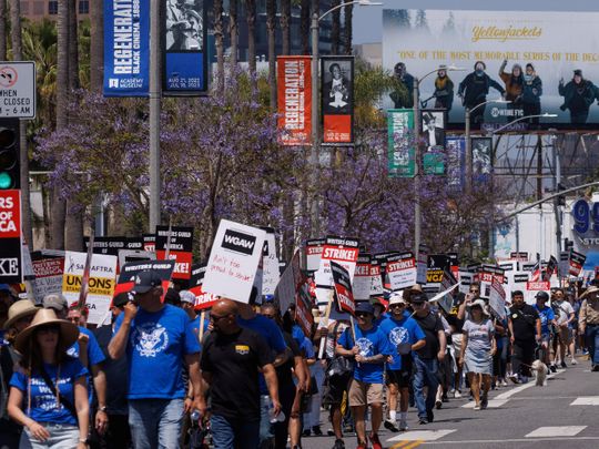 Members of the Writers Guild of America stage a march in Los Angeles.