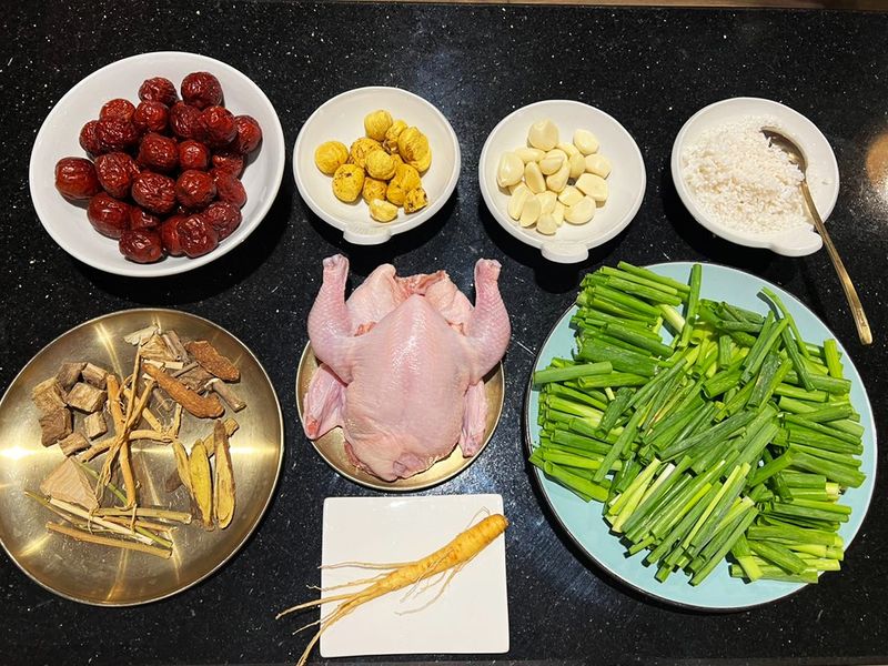 The main ingredients for Samgyetang – ginseng, chicken, scallions and various herbs