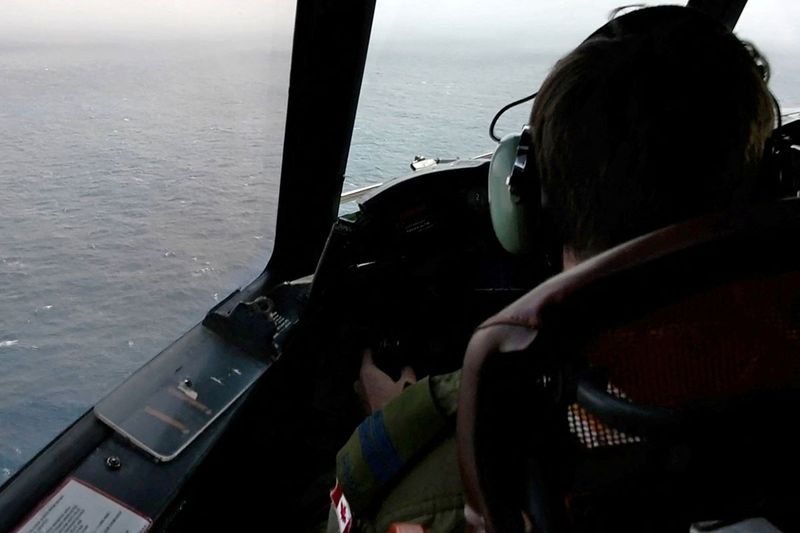 The pilot of a Royal Canadian Air Force CP-140 Aurora maritime surveillance aircraft of 14 Wing flies a search pattern for the missing OceanGate submersible, which had been carrying five people to explore the wreck of the sunken SS Titanic, in the Atlantic Ocean off Newfoundland, Canada June 20, 2023 in a still image from video. 