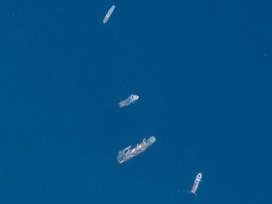 A satellite image shows ships taking part in the search and rescue operations associated with the missing Titan submersible near the wreck of the Titanic, on June 22, 2023. 