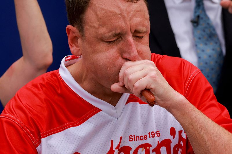 World Champion Joey Chestnut competes in the 2023 Nathan's Famous Fourth of July International Hot Dog Eating Contest at Coney Island in New York City, U.S., July 4, 2023. 