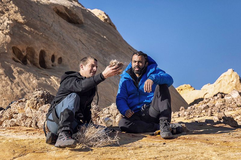 This image released by Nat Geo shows Bear Grylls, left, and Daveed Diggs at Eldorado Canyon, Utah, in a scene from “Running Wild with Bear Grylls: The Challenge,