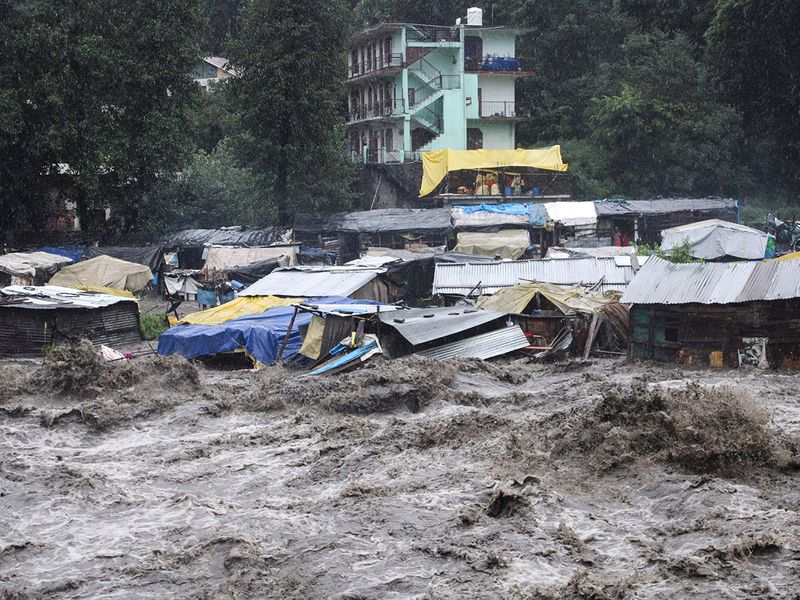 A swollen River Beas following heavy rains in Kullu, Himachal Pradesh, India, Sunday, July 9, 2023. According to local reports heavy rain fall has triggered landslides, damaged houses and caused loss of lives.