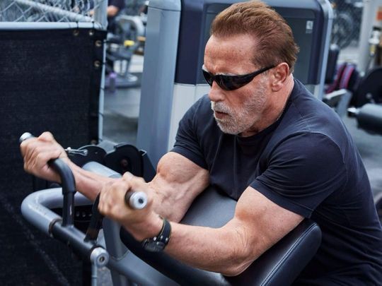 Hollywood actor Arnold Schwarzenegger pumps iron, flaunts strength