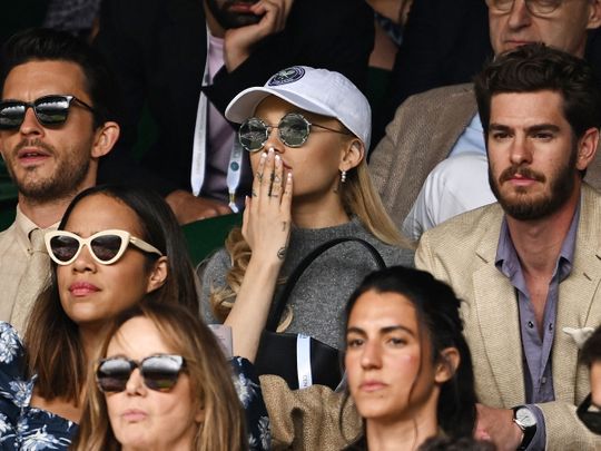 Actor Jonathan Bailey, singer Ariana Grande and actor Andrew Garfield in the stands during the men's singles final at Wimbeldon.