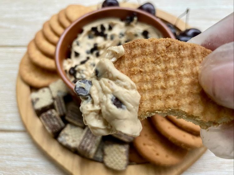 Transfer the dip to a serving bowl and serve with crackers, pretzels, wafers or fruits 