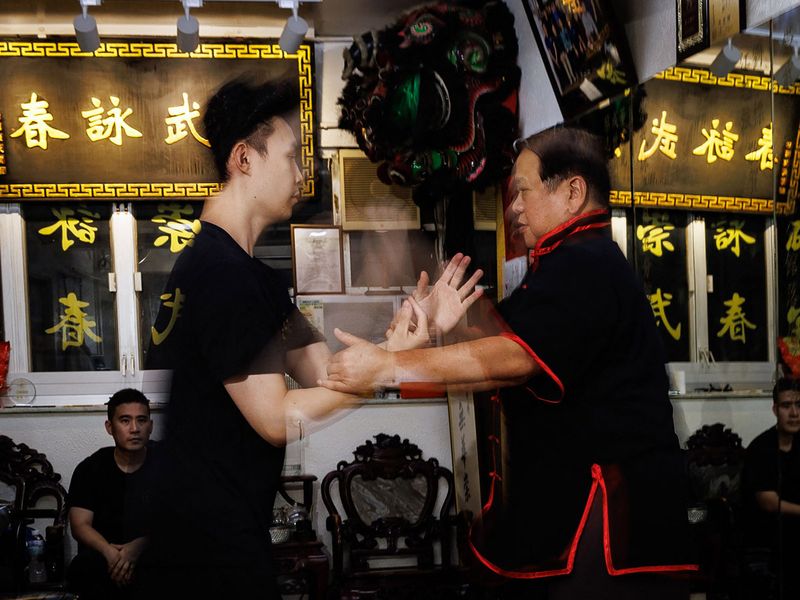 Cheng Chi-ping (R) practices Wing Tsun with a student at the Sung Mo Wing Tsun Athletic Association studio in the Sham Shui Po area of Hong Kong.