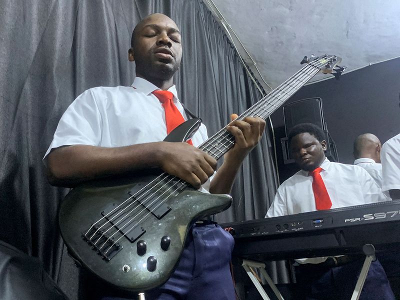 Okeke Emeka and Mustapha Yusuf, visually impaired instrumentalists, play the guitar and keyboard