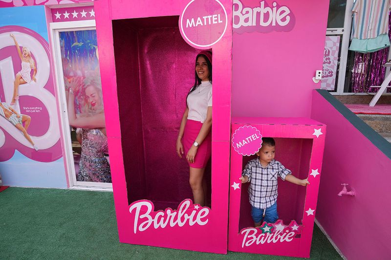 A family visits a Barbie-themed restaurant in Guayaquil, Ecuador, Friday, July 21, 2023.