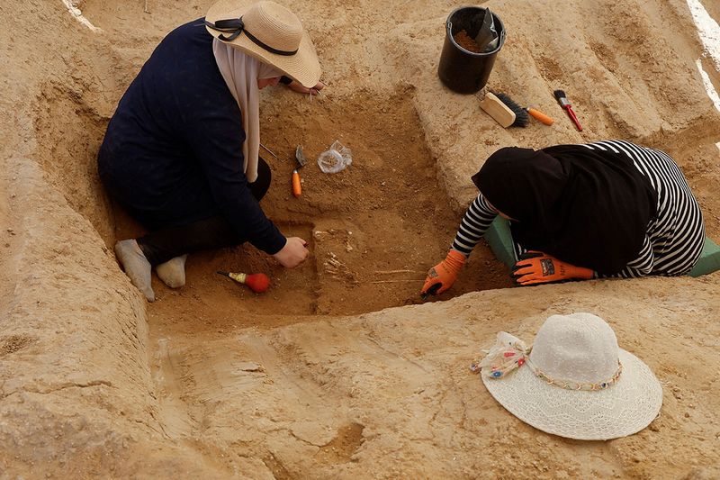 Palestinian engineers work in a Roman-era cemetery in Gaza, July 23, 2023.  