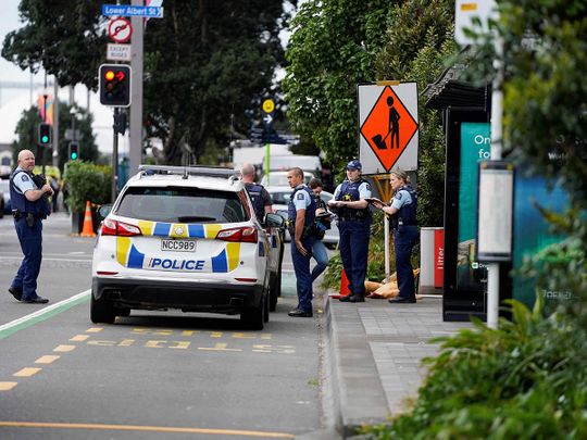 Police officers stand at the scene of a shooting in downtown Auckland on July 20, 2023. New Zealand Prime Minister Chris Hipkins said a shooting that killed two people in central Auckland hours before the women's football World Cup opener July 20, 2023 was not linked to a national security threat and the tournament will go ahead as planned.