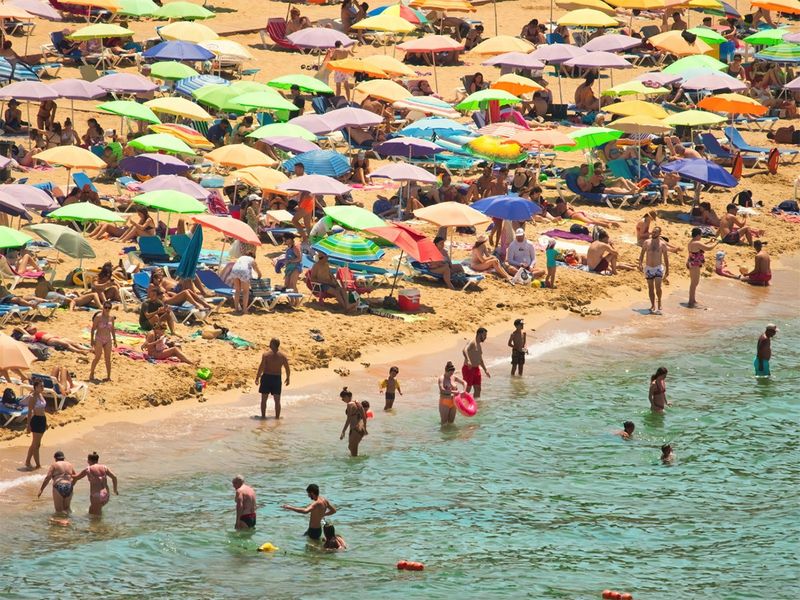 Golden Bay, Mellieha, Malta -: A crowded sandy beach 