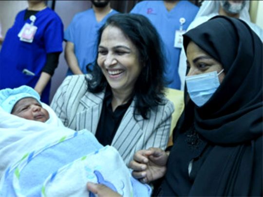 A thankful Hanan, 38, right, with her newborn Suhail Al Kaabi and Dr. Sulsa M. Jain