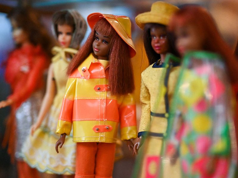 A photo shows Barbie dolls at the 
