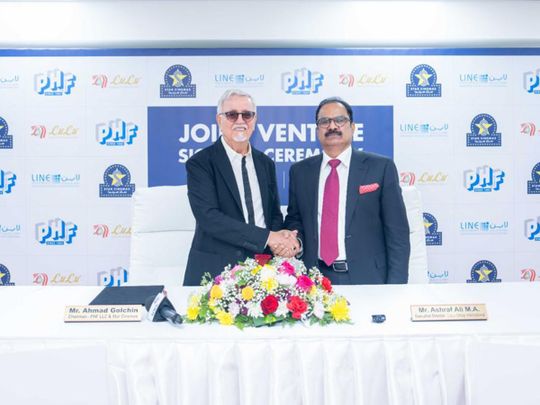MA Ashraf Ali, Executive Director of Lulu Group International and Ahmad Golchin, Chairman Phars Film and Stars Cinema sign joint venture agreement at Lulu Regional Office, Al Qusais.
