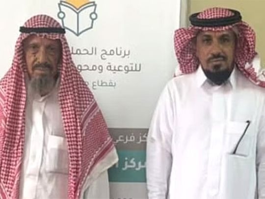 Hassan Al Eis (right) with his father.  