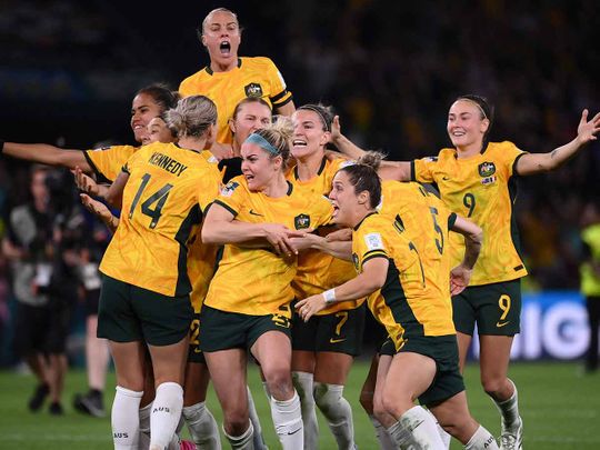 Australian players celebrate their win at the end of the Australia and New Zealand 2023 Women's World Cup quarter-final football match between Australia and France at Brisbane Stadium in Brisbane on August 12, 2023.
