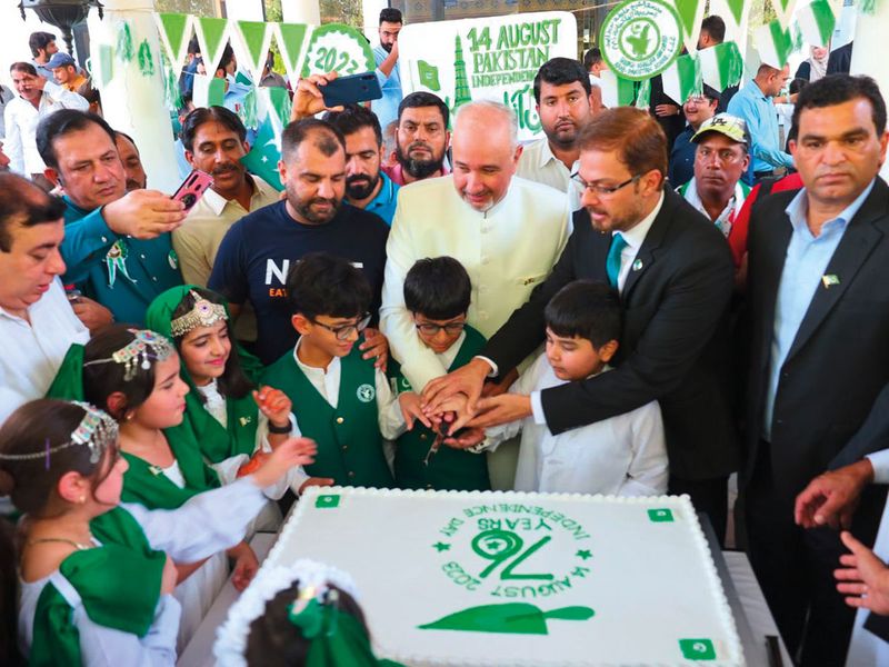 Ambassador-of-Pakistan-to-the-UAE,-Faisal-Niaz-Tirmizi-(cente),-cutting-a-celebatory-cake-at-the-Emabassy-of-Pakistan-in-Abu-Dhabi-(Read-Only)